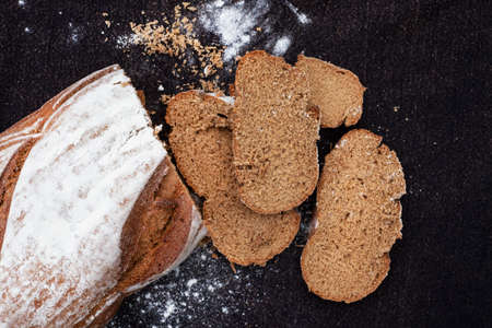 Loaf of fresh Rye bread on rustic background with copy spaceの写真素材
