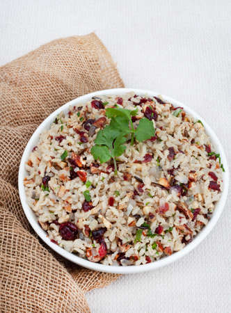 Delicious and healthy Wild rice pilaf with cranberries and pecan nutsの写真素材
