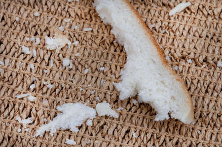 Crusts and crumbs of white bread slices as food security and shortages loom