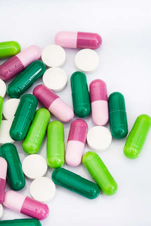 mixture of colorful medicinal capsules or medication in studio shot with copy space