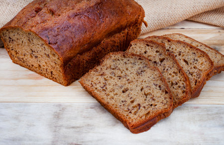freshly baked rustic style banana bread loaf on country style table