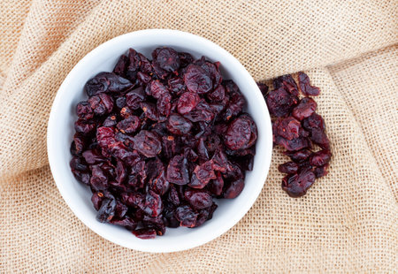 dried cranberries on rustic surface with copy space