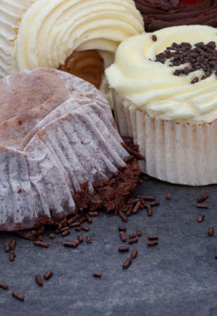 cupcake fallen upside down on icing with messed sprinkles