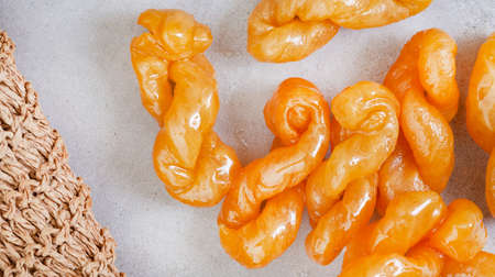 Delicious, golden, syrup drenched South African traditional koeksisters