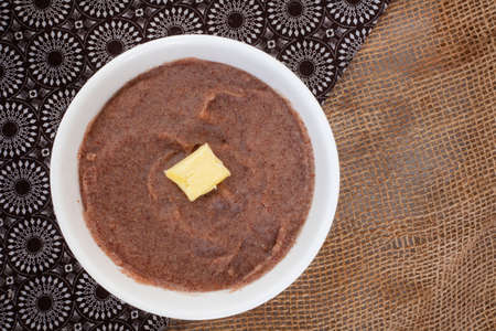 Traditional  African Sorghum breakfast porridge or Mabele, on mottled grey with copy spaceの写真素材