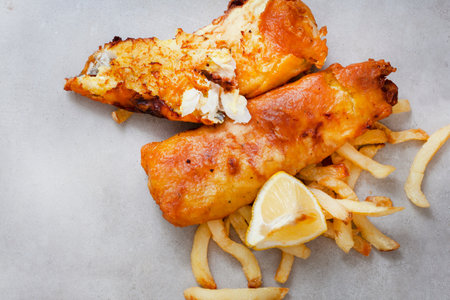 classic old fish and chips, South African street style. Mottled grey surface with copy space