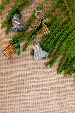 South African Beaded Christmas decorations with tree bits on rustic burlap fabricの写真素材