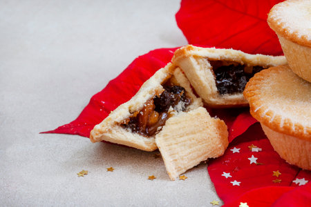 Christmas fruit mince pies on gray surface with lots of copy spaceの写真素材