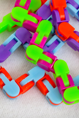 Fidget tracks, a snap and click bicycle chain toy for twisting and fidgeting on white backgroundの写真素材
