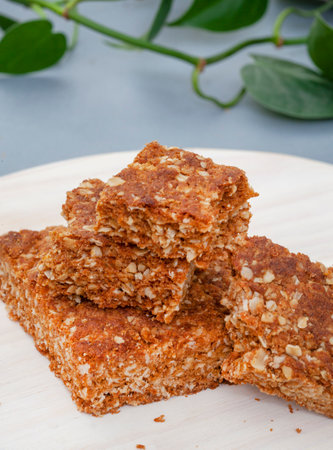 old fashioned granola oat squares on light woodの写真素材