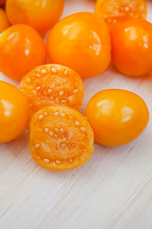 Cape gooseberry (Physalis peruviana) on wooden backgroundの写真素材