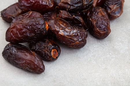 Close-up of dried dates fruits on white background. Selective focus.の写真素材