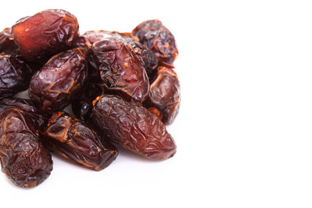 Dried dates fruit on white background. Top view. Copy space.の写真素材