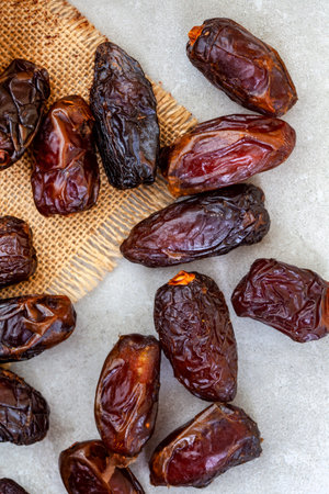Dried dates on a wooden background. Top view. Copy space.の写真素材