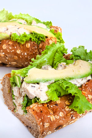 Sandwiches with chicken, avocado and lettuce on a white backgroundの写真素材