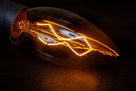 Light bulb on black, South Africa in Electricity disasterの写真素材