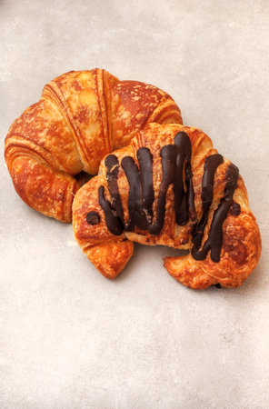 Freshly baked croissants with chocolatele background, top viewの写真素材