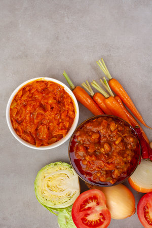 Traditional South African Chakalaka, popular spicy side dish or relish. On mottled grey with copy spaceの写真素材