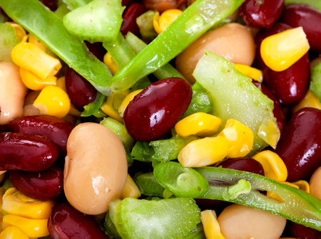 closeup of a mixed vegetable salad with corn, green beans, red beans