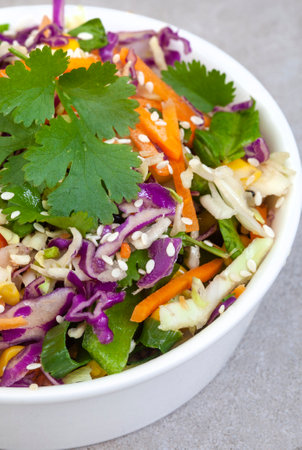 Vegetable salad with cabbage, carrot, onion and sesame seedsの写真素材