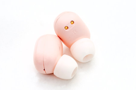 Wireless headphones on a white background. Close-up image.の写真素材
