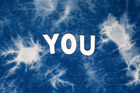 you written in white lettering on full frame grunge blue tie dye backgroundの写真素材