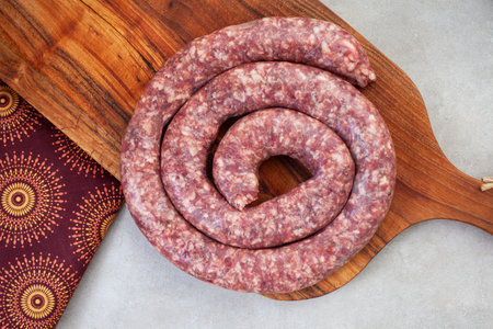 Traditional South African wors or sausage with iconic African printed fabric.の写真素材