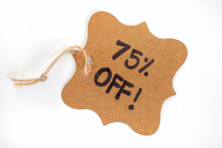 Price tag with the words 75% off on a white background.の写真素材