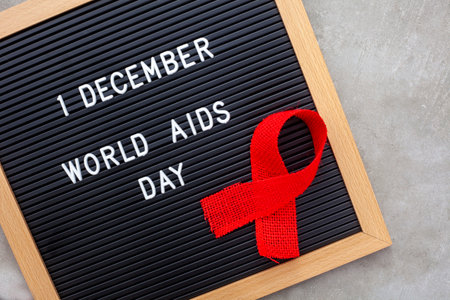 Blackboard with red ribbon and text  world aids dayの写真素材