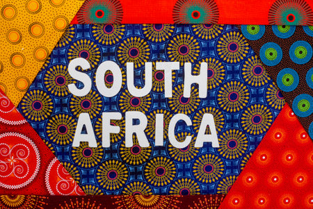 for South Africa, in white letters with iconic South African Shwe Shwe fabric
