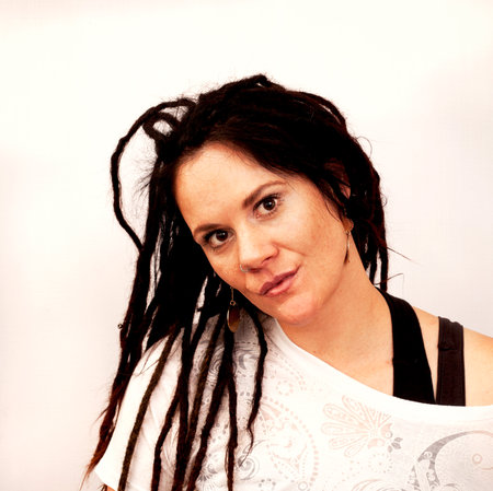 Portrait of a beautiful young woman with dreadlocks on a white backgroundの写真素材