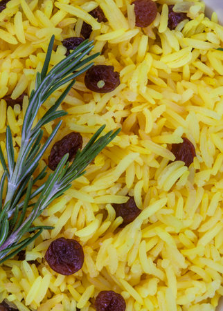 Traditional South African yellow rice, made with turmeric and raisins with rosemary garnish.
Close up, full frame shotの写真素材