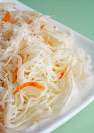 pickled cabbage on a white plate close upの写真素材