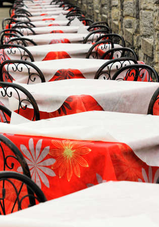 row of empty tables at an outdoor cafe San Marino