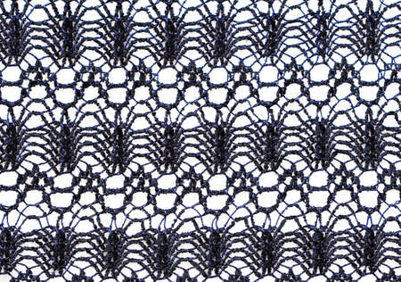 fragment of blue openwork cloth on a white background