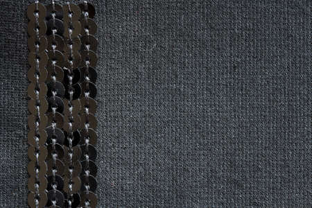 black knitted fabric with vertical stripe sequins,  backgroundの写真素材