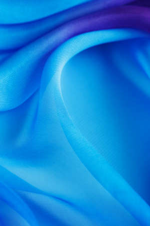 abstract background folds blue transparent fabricの写真素材