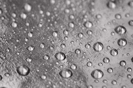 Drops on a gold background macro, shallow depth of field, abstract backgroundの写真素材