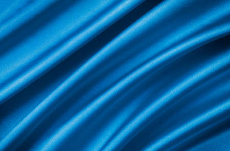 drape a bright  blue satin fabricの写真素材