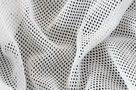 wrinkled white mesh sport fabric  with foldsの写真素材