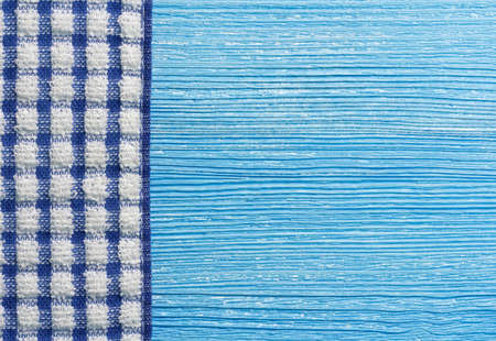 blue wooden background with napkinの写真素材