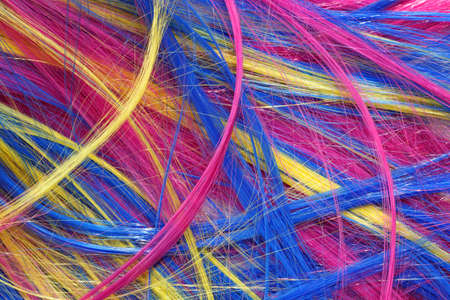 wig of synthetic hair with colored  strands  for carnival as backgroundの写真素材