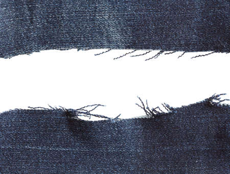 Blue torn pieces of jeans, fabric texture isolated on white backgroundの写真素材