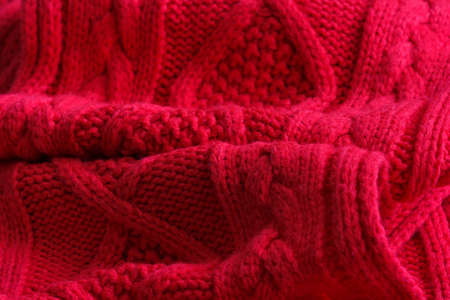 fragment of red knitted fabricの写真素材