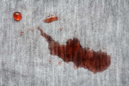 Stain from jam on gray cotton clothesの写真素材