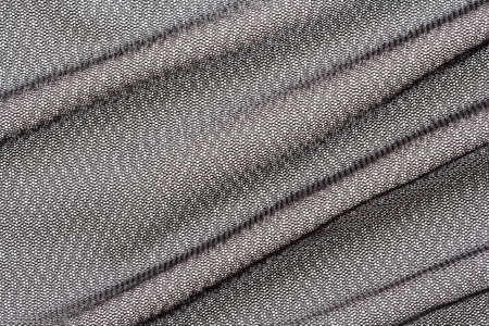 delicate black mesh fabric with large diagonal folds