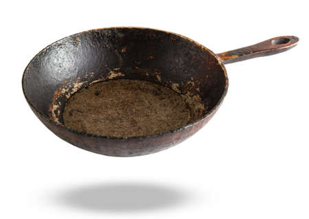 Old cast iron frying pan isolated on white backgroundの写真素材