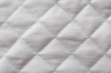 Quilted white cotton fabric, textureの写真素材