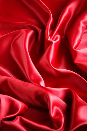 red satin fabric with large folds,  abstract backgroundの写真素材