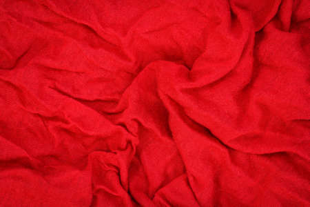 Knitted simple fabric with large folds, reverse stockinette stitch backgroundの写真素材